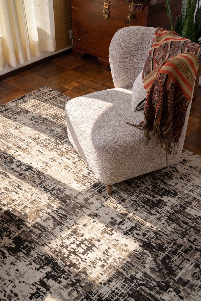 An NP Rugs rug under a chair