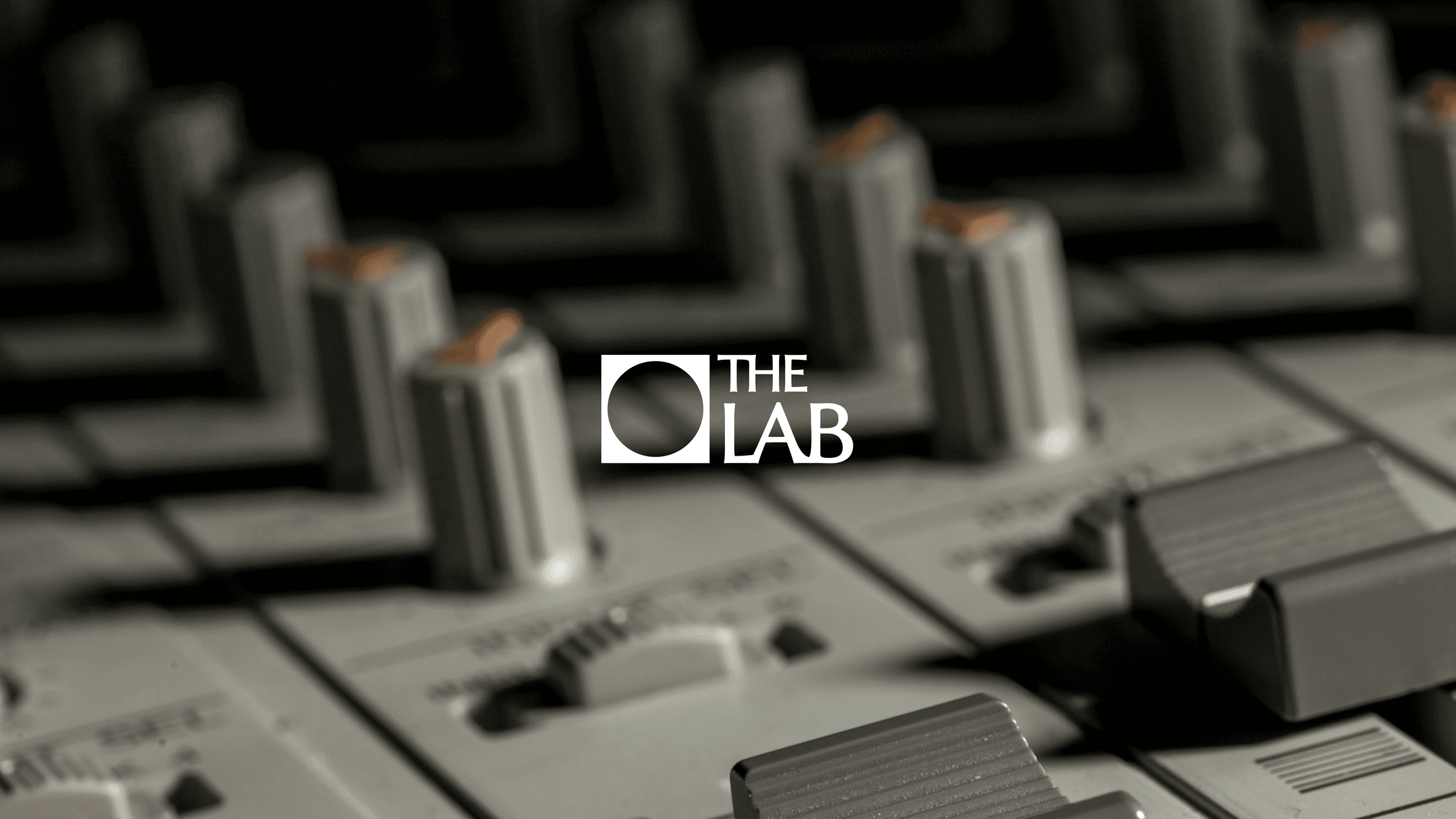 The Lab brand identity: the logo over a mixing desk