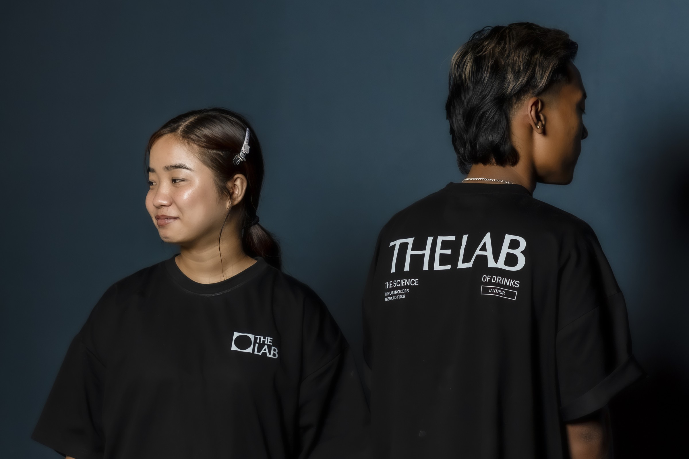 Two staff in The Lab T-shirts