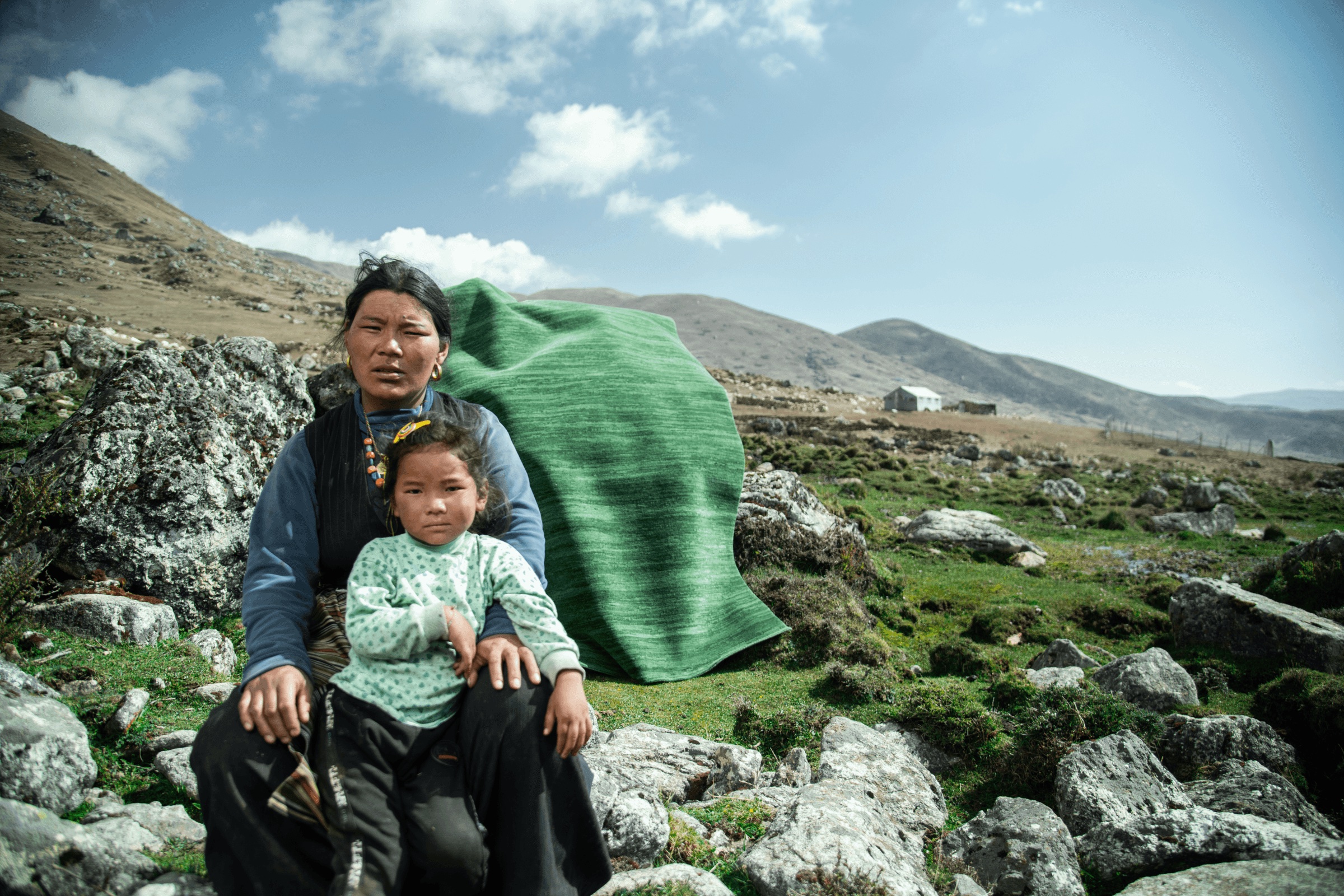 A mother and child in Mustang with an NP Rugs rug